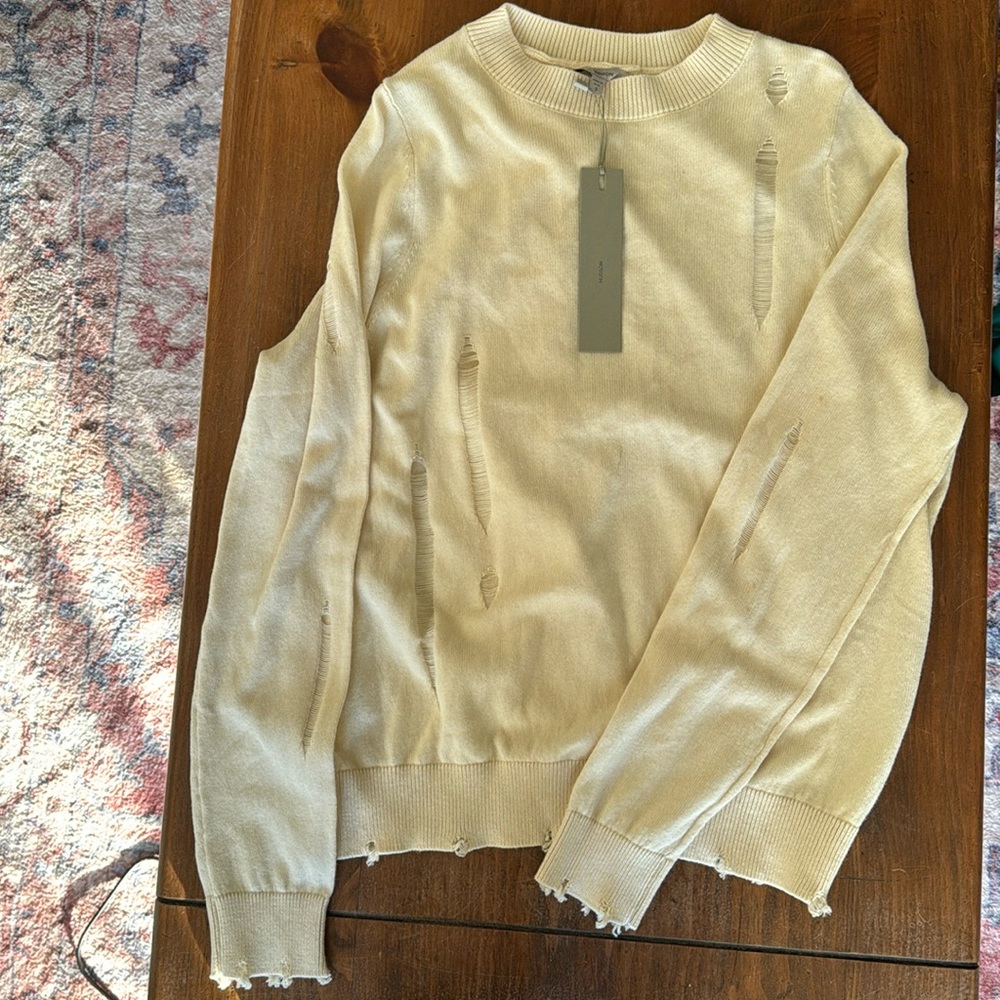 Distressed sweater